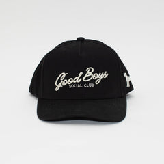 Front view of the Black Label black hat with cream Good Boys Social Club embroidery and a curved brim.