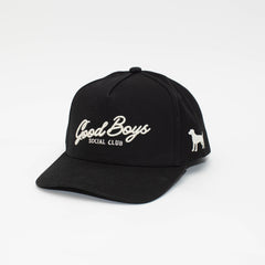 Angled view of the Black Label black hat with cream Good Boys Social Club embroidery and a dog silhouette on the side.