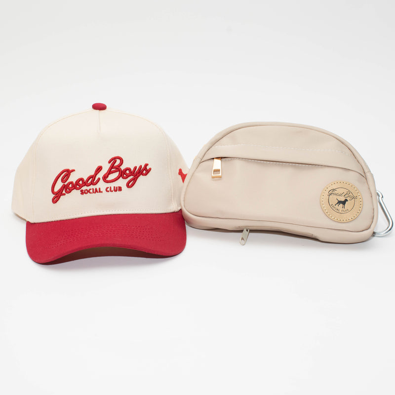 The Kit featuring a cream and red Crimson Good Boys Social Club hat beside a beige Go Bag with a round logo patch.